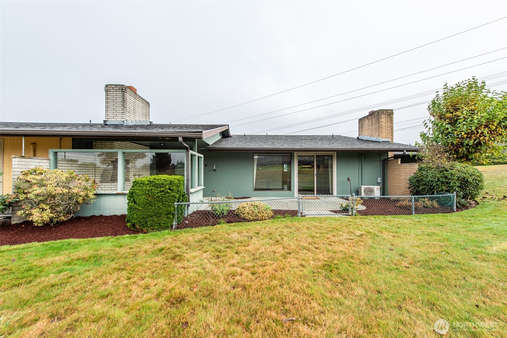 1301 South 3rd Avenue, Unit 19D Sequim, WA 98382 - Photo 22 of 35 a view of a house with sitting area and garden