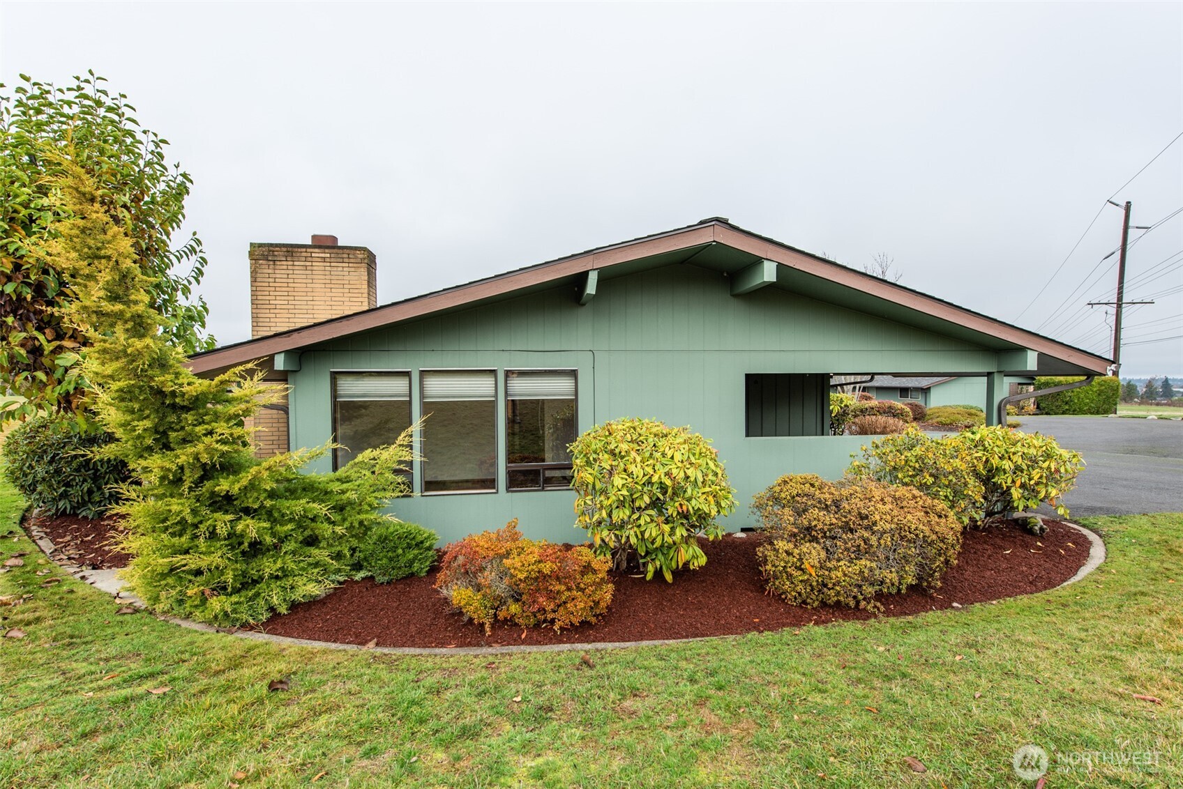 1301 South 3rd Avenue, Unit 19D Sequim, WA 98382 - Photo 26 of 35 front view of a house with a yard