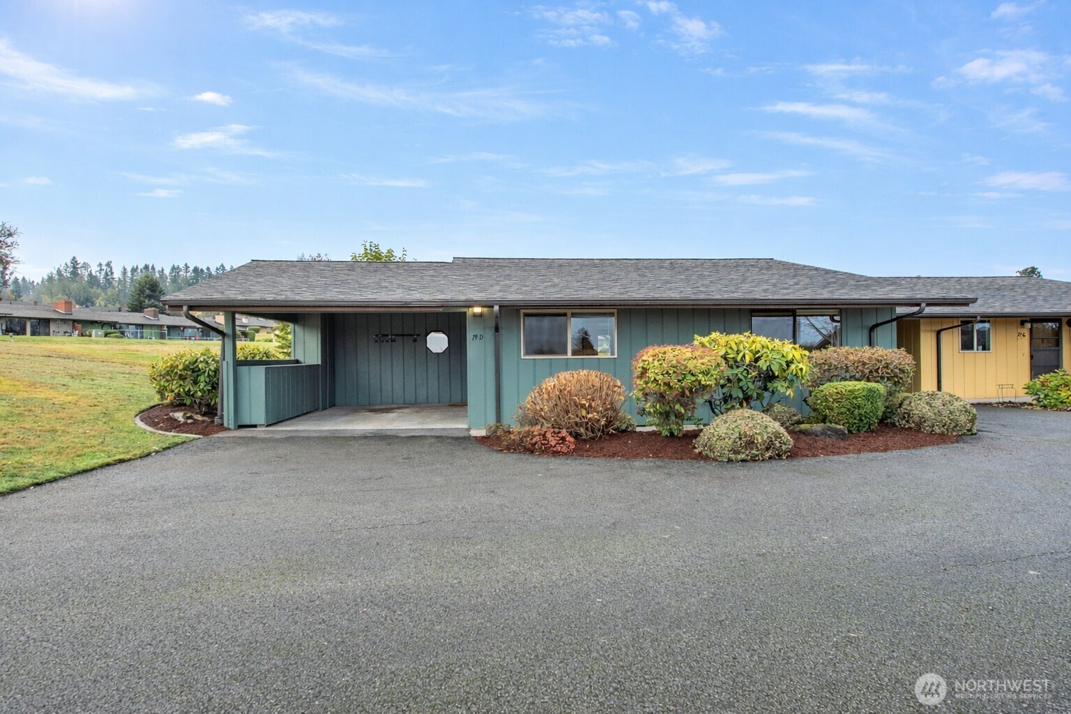 1301 South 3rd Avenue, Unit 19D Sequim, WA 98382 - Photo 3 of 35 a view of a house with a garden and balcony
