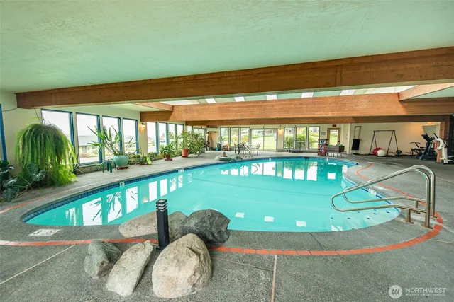 a view of a living room and floor to ceiling window