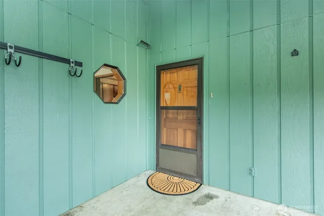 a view of a bathroom with a sink and a mirror