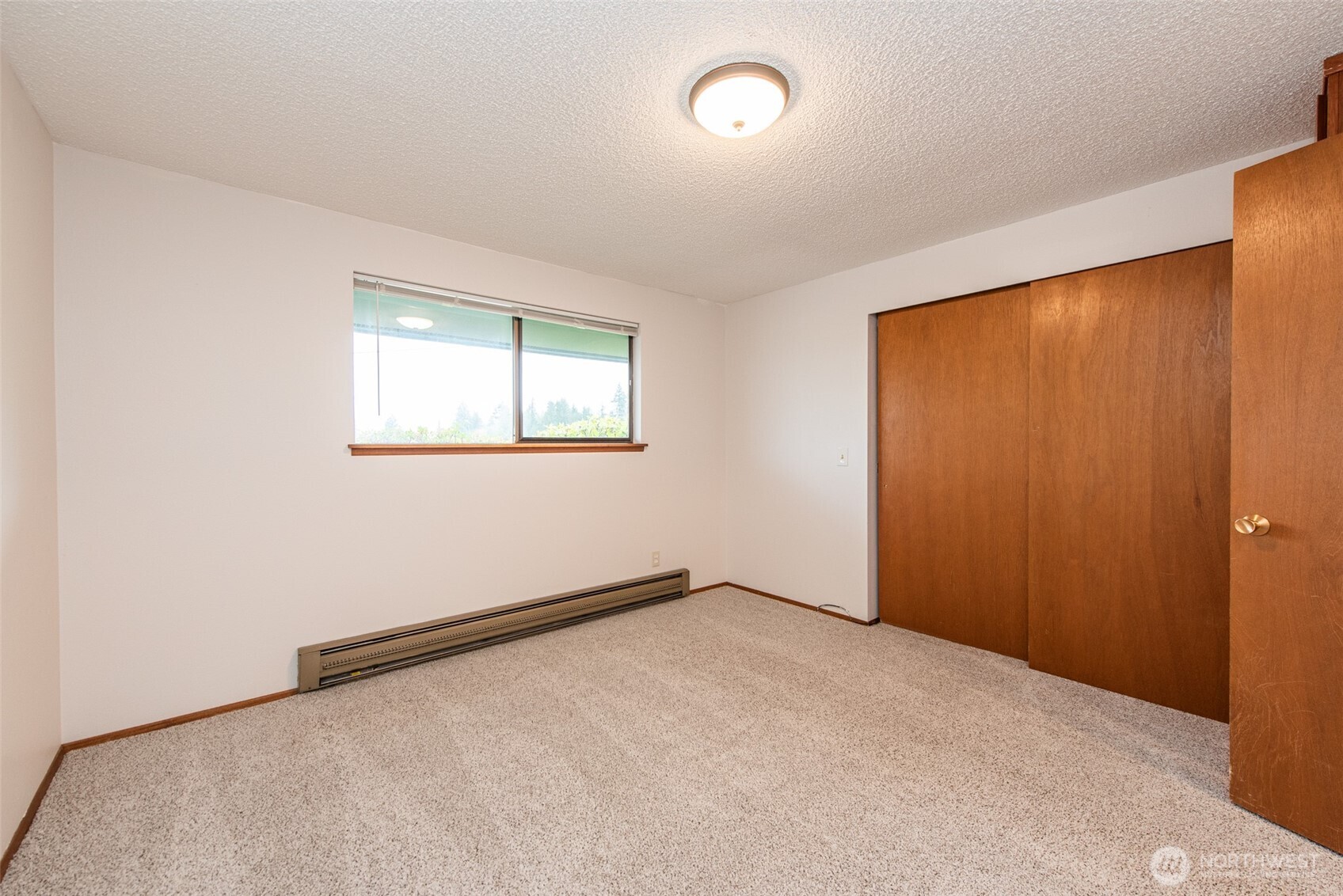 1301 South 3rd Avenue, Unit 19D Sequim, WA 98382 - Photo 9 of 35 an empty room with a window
