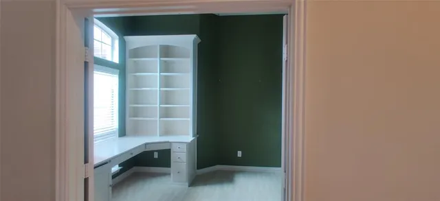 a view of an empty room with a window