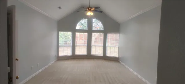 an empty room with a empty space and windows