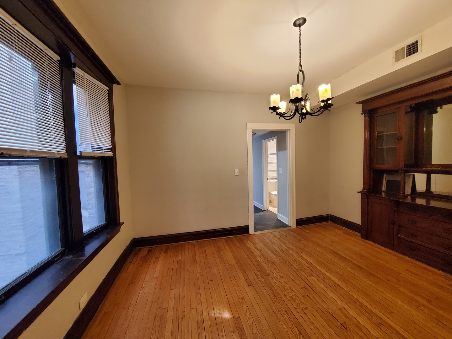 665 West Roscoe Street, Unit 1 Chicago, IL 60657 - Photo 3 of 10 a view of empty room with wooden floor