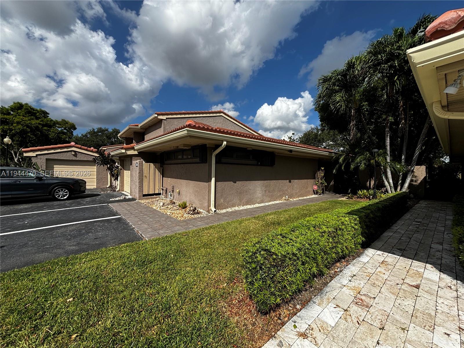 2001 St Andrews Road, Unit 121 Hollywood, FL 33021 - Photo 11 of 39 a front view of a house with a yard