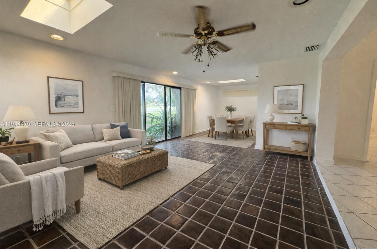 2001 St Andrews Road, Unit 121 Hollywood, FL 33021 - Photo 2 of 39 a living room with furniture and a rug
