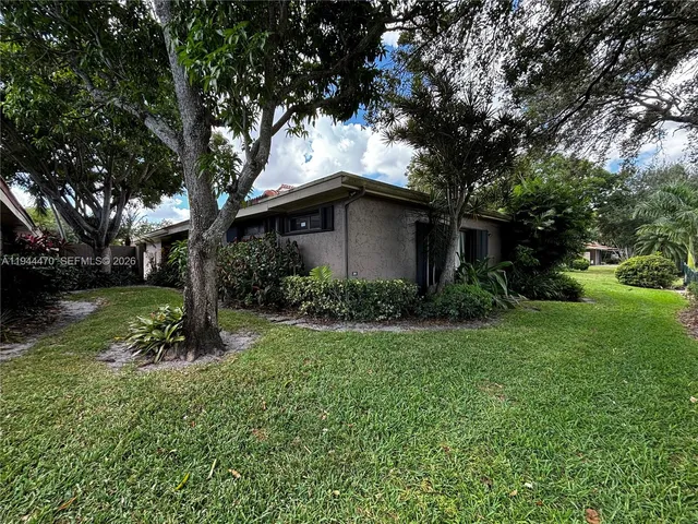 a backyard of a house with lots of green space