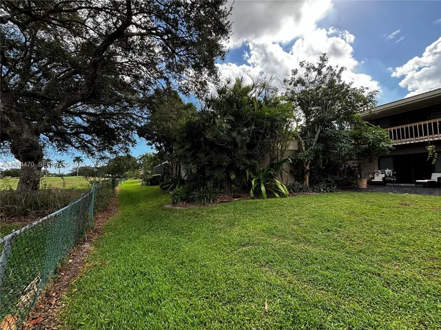 a view of a garden with a fountain