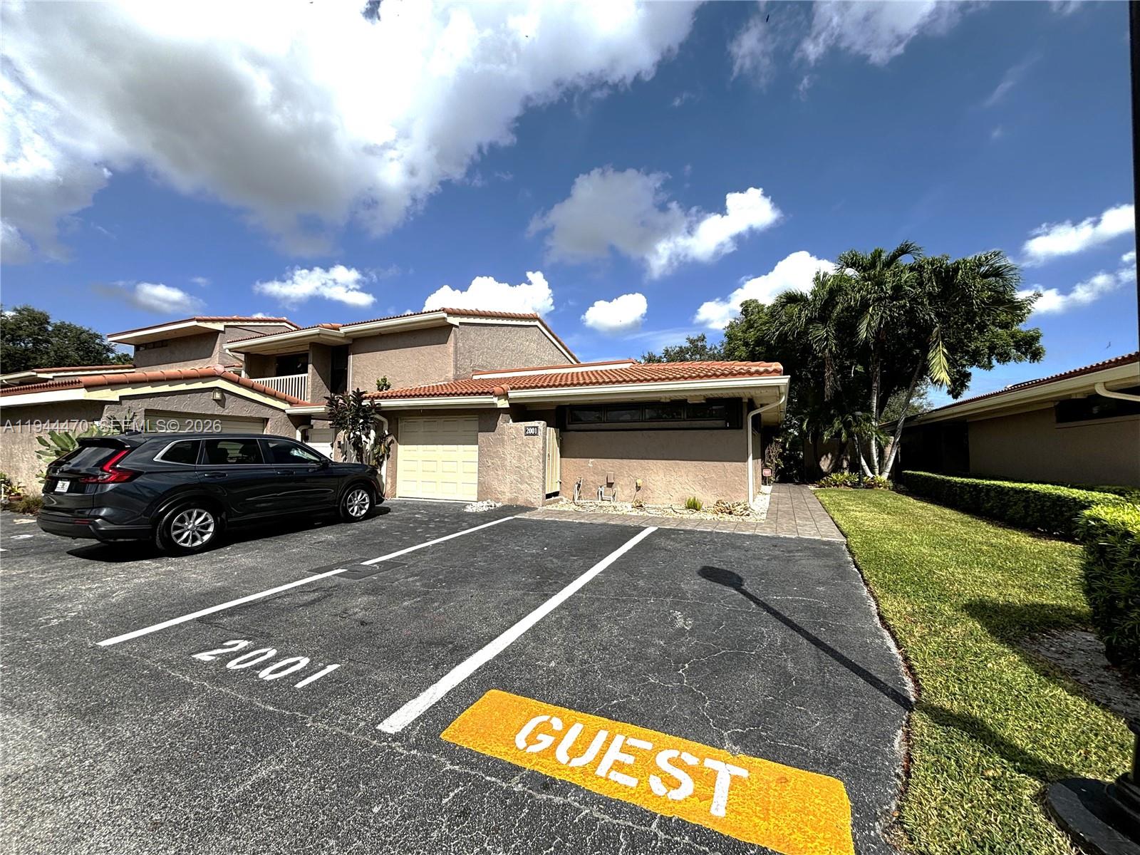 2001 St Andrews Road, Unit 121 Hollywood, FL 33021 - Photo 8 of 39 a view of a car park in front of house