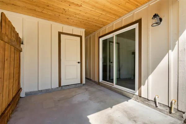 a kitchen with granite countertop a stove top oven sink and cabinets