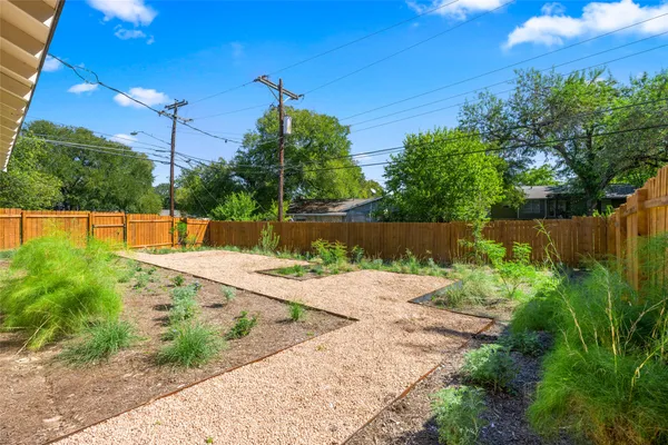 a kitchen with stainless steel appliances a sink stove and cabinets
