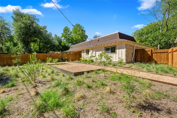 a bedroom with a bed and potted plant