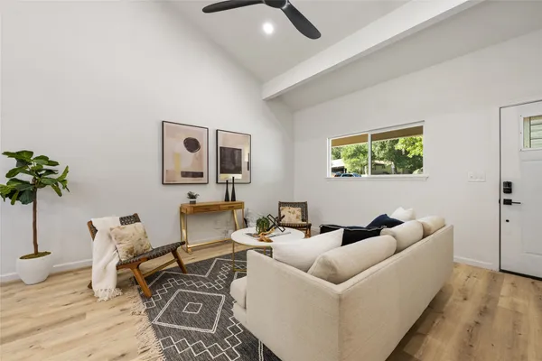 a dining room with furniture and wooden floor