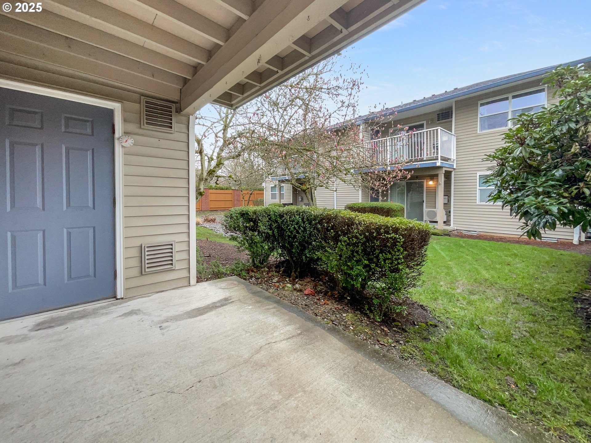 4606 West Powell Boulevard, Unit 163 Gresham, OR 97030 - Photo 16 of 19 a front view of a house with a yard