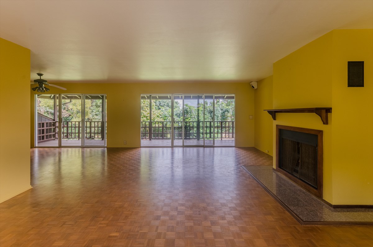 4110 Koloa Road Koloa, HI 96756 - Photo 13 of 18 a view of empty room with wooden floor and fireplace