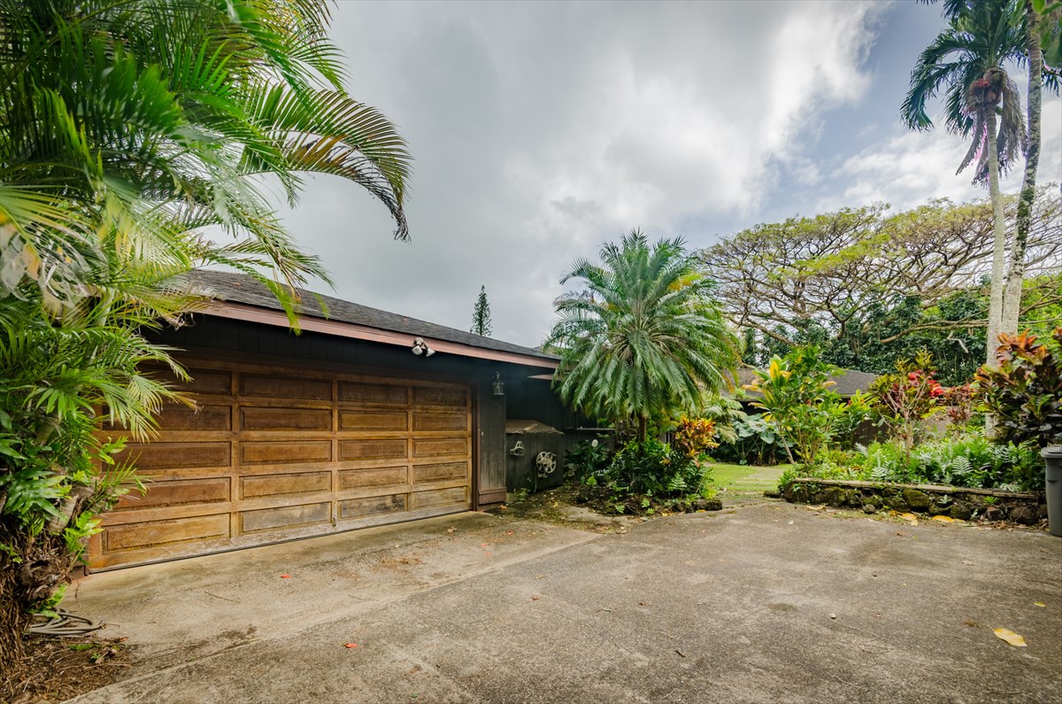 4110 Koloa Road Koloa, HI 96756 - Photo 3 of 18 a front view of a house with a garden