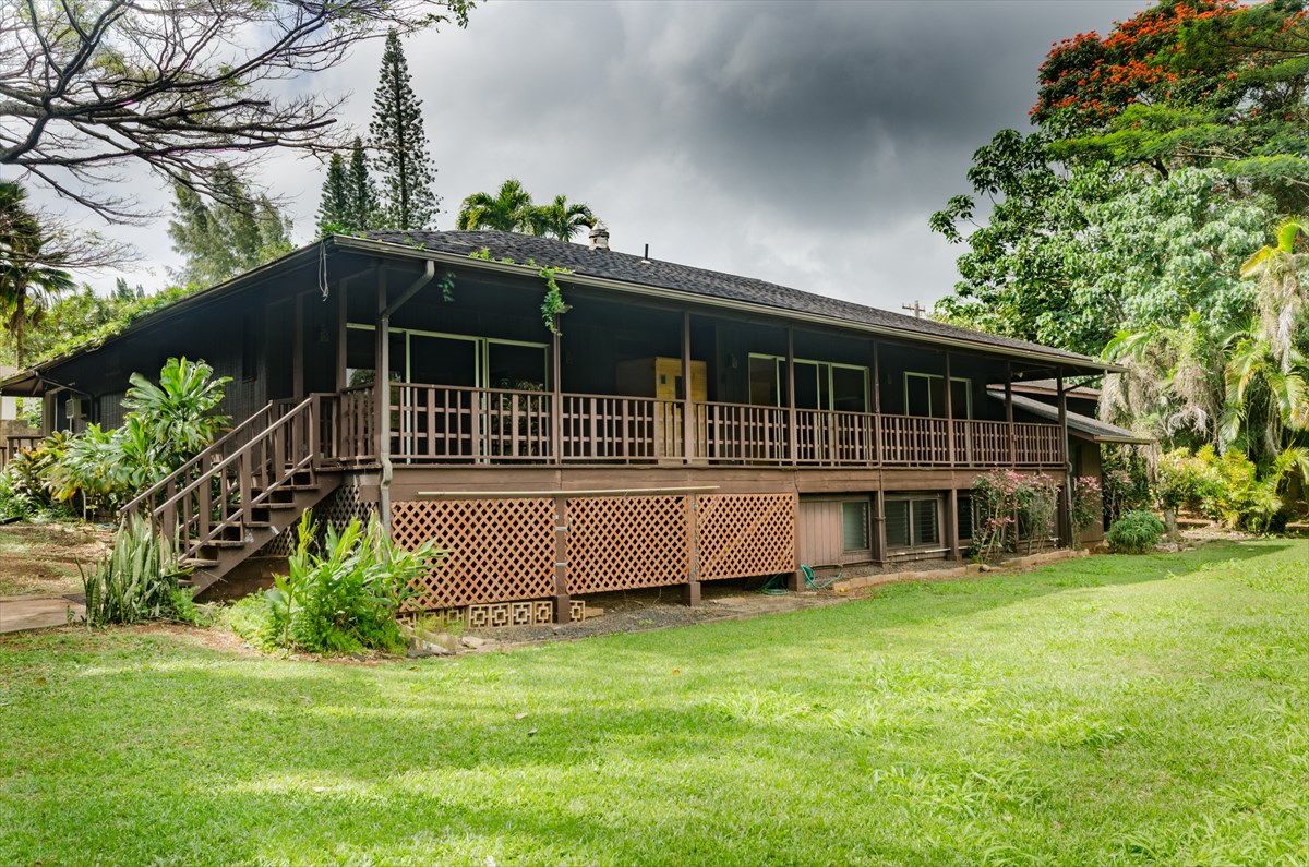 4110 Koloa Road Koloa, HI 96756 - Photo 9 of 18 a front view of a house with a garden