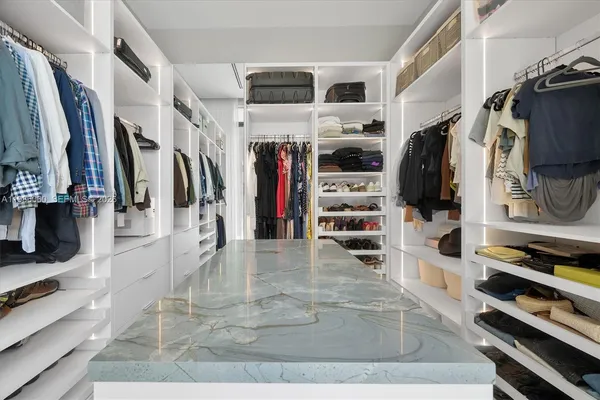 a bedroom with a bed and a table