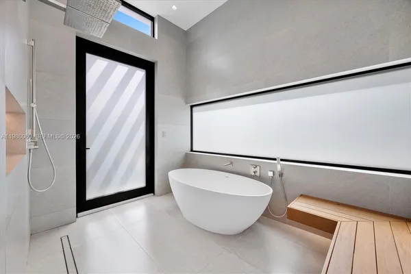 a bathroom with a toilet sink and shower