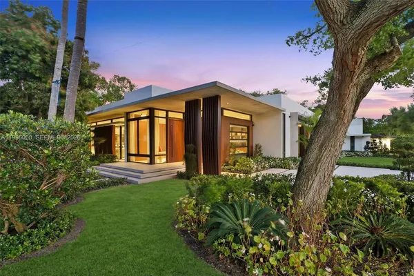 a view of a house with swimming pool and porch with furniture