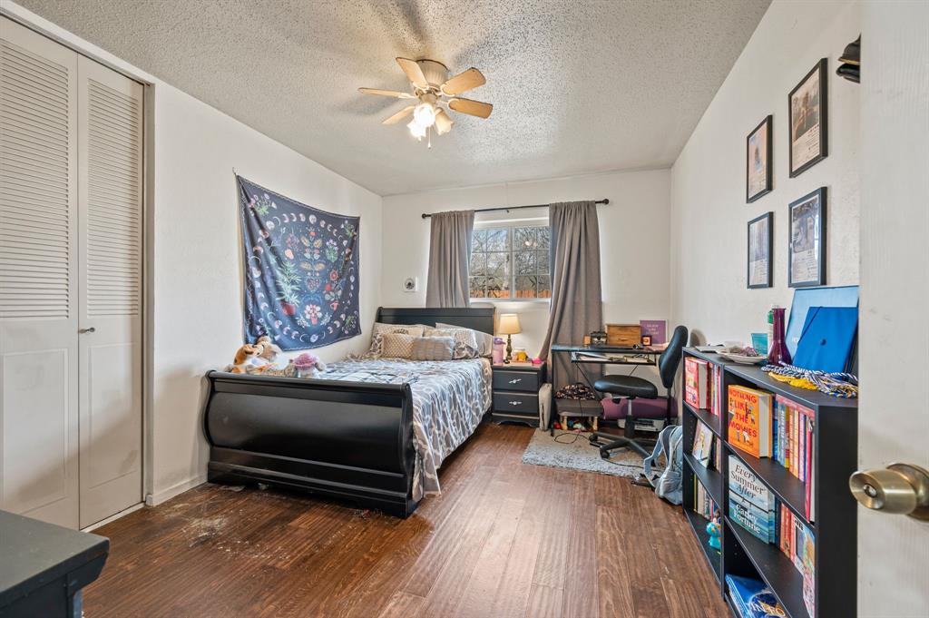 2125 Shady Brook Drive Bedford, TX 76021 - Photo 14 of 24 a bedroom with furniture and a window