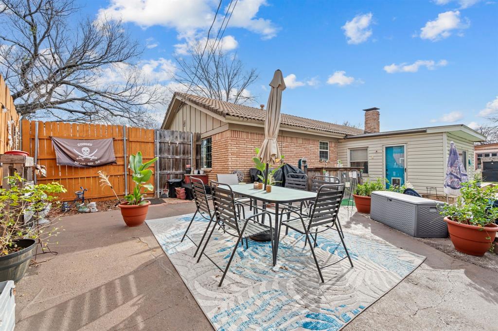 2125 Shady Brook Drive Bedford, TX 76021 - Photo 20 of 24 a view of a patio with couches table and chairs and potted plants