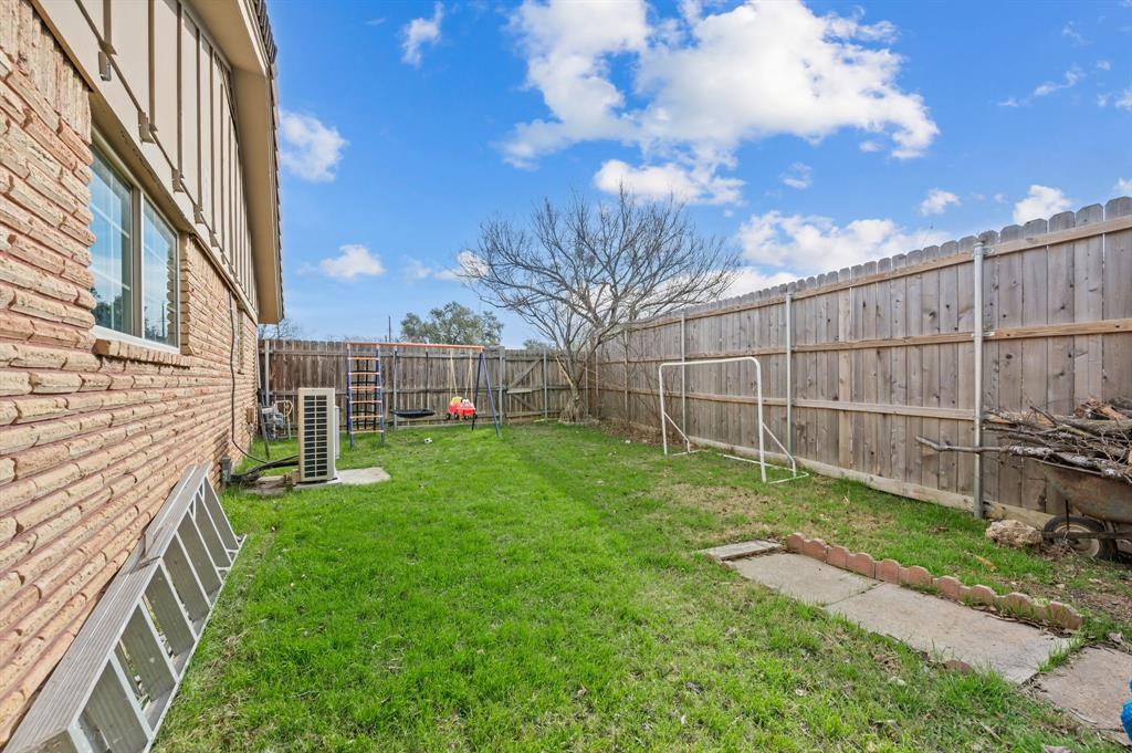 2125 Shady Brook Drive Bedford, TX 76021 - Photo 23 of 24 a view of a backyard with a garden