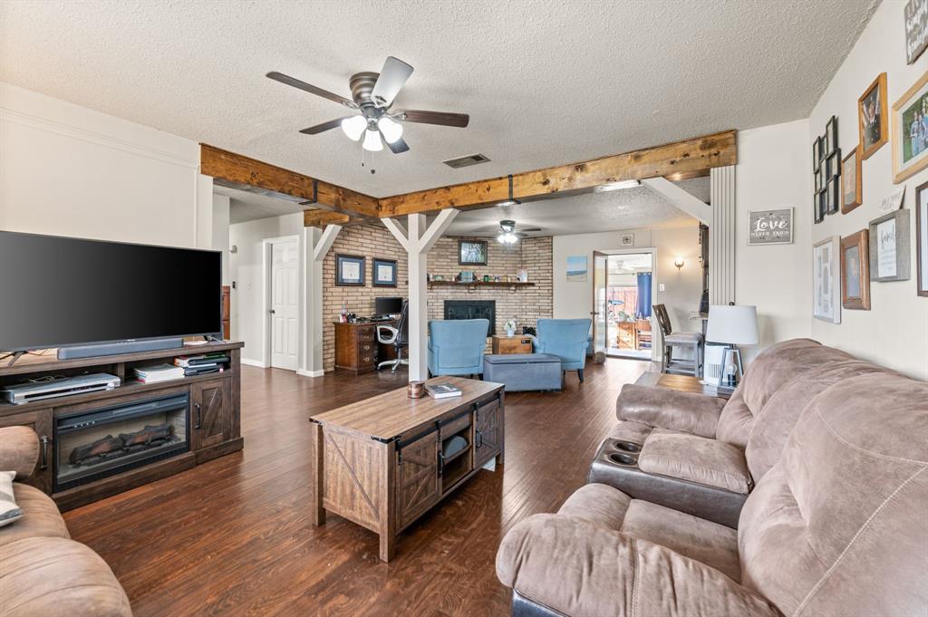 2125 Shady Brook Drive Bedford, TX 76021 - Photo 4 of 24 a living room with furniture and a flat screen tv
