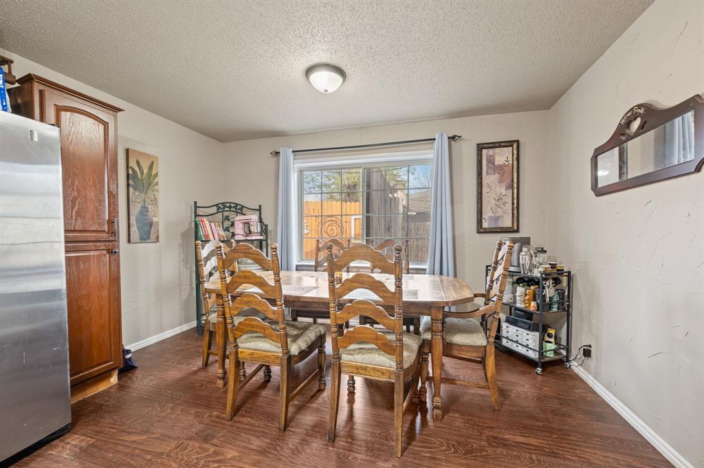 2125 Shady Brook Drive Bedford, TX 76021 - Photo 10 of 24 a dining room with furniture window and wooden floor