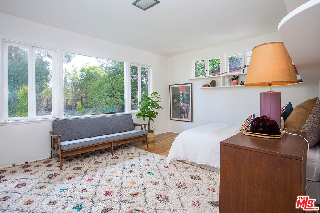 1081 Alta Pine Drive Altadena, CA 91001 - Photo 15 of 38 a bedroom with a bed and a window