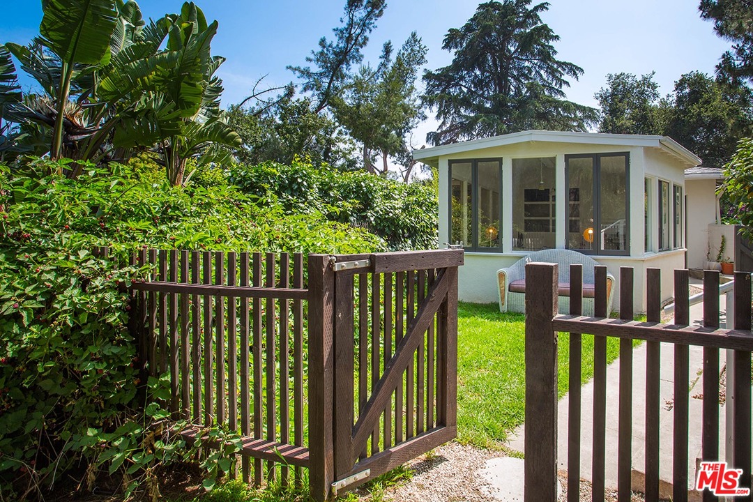 1081 Alta Pine Drive Altadena, CA 91001 - Photo 18 of 38 a view of a house with a small yard and plants