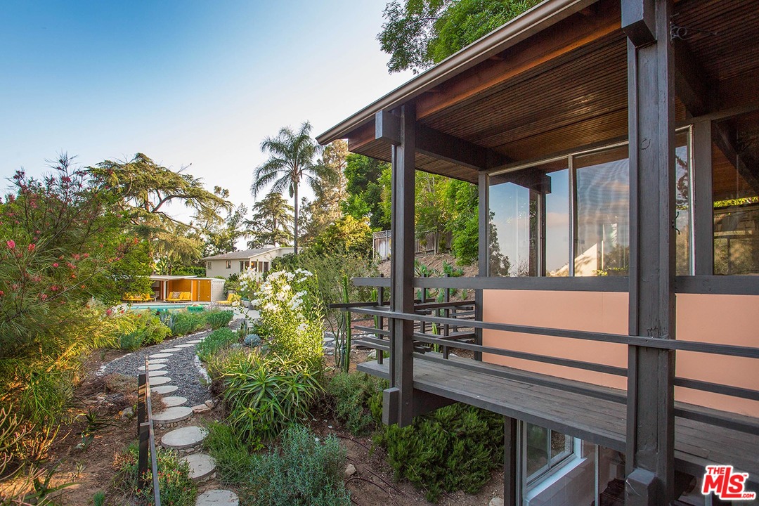 1081 Alta Pine Drive Altadena, CA 91001 - Photo 22 of 38 a view of a house with a tree in a yard
