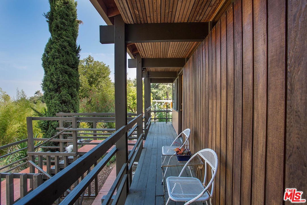 1081 Alta Pine Drive Altadena, CA 91001 - Photo 24 of 38 a balcony with chairs and a table