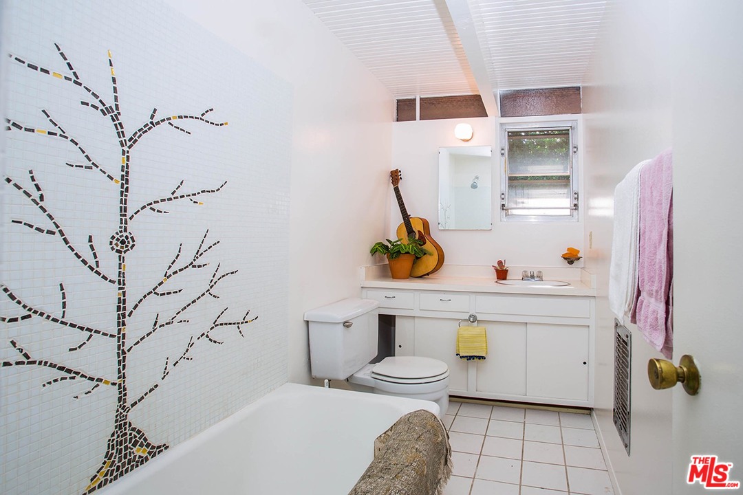 1081 Alta Pine Drive Altadena, CA 91001 - Photo 28 of 38 a bathroom with a sink toilet and shower