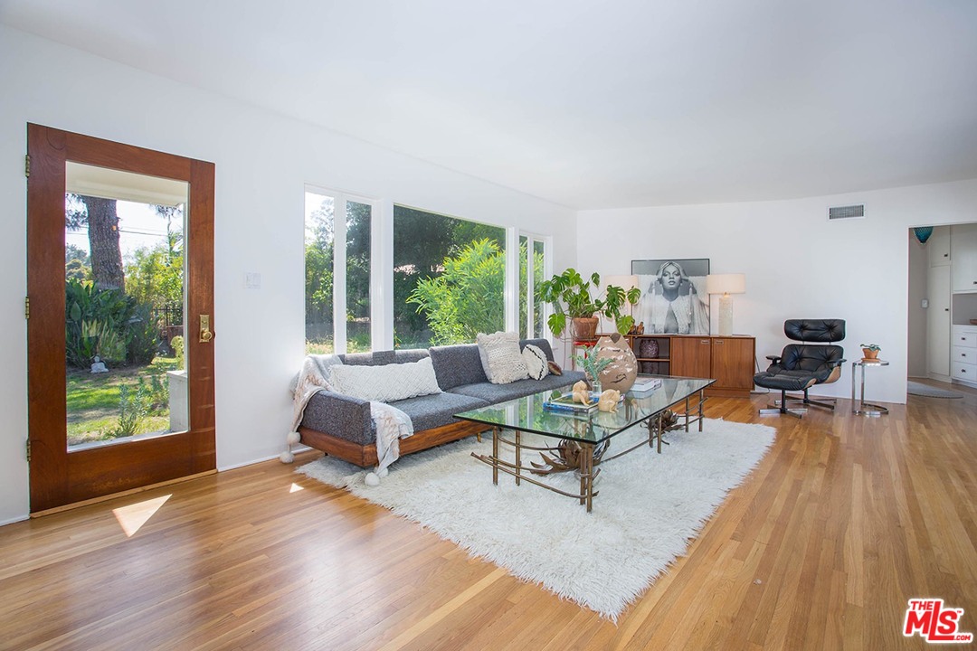 1081 Alta Pine Drive Altadena, CA 91001 - Photo 4 of 38 a living room with furniture and large windows