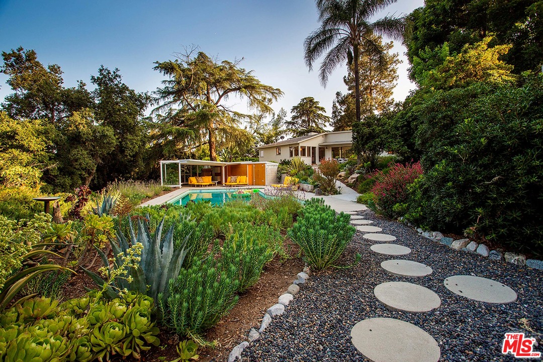 1081 Alta Pine Drive Altadena, CA 91001 - Photo 33 of 38 a view of a backyard with plants and a garden
