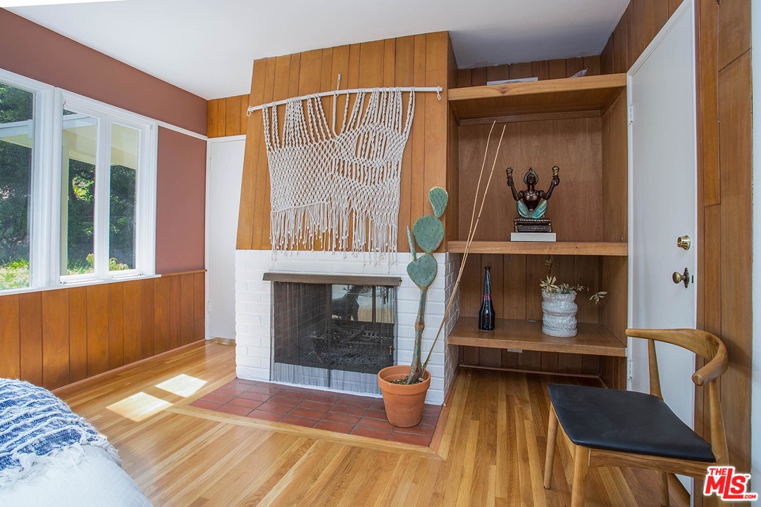 1081 Alta Pine Drive Altadena, CA 91001 - Photo 7 of 38 a living room with furniture and a fireplace
