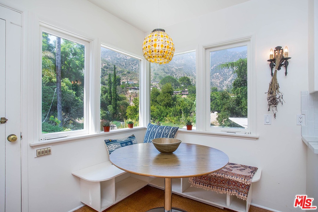 1081 Alta Pine Drive Altadena, CA 91001 - Photo 10 of 38 a view of a dining room with furniture a chandelier and wooden floor