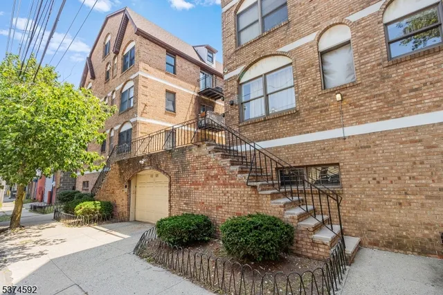 a view of a brick building with many windows