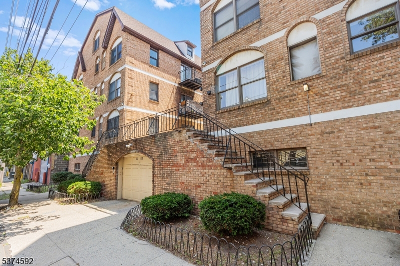 a view of a brick building with many windows
