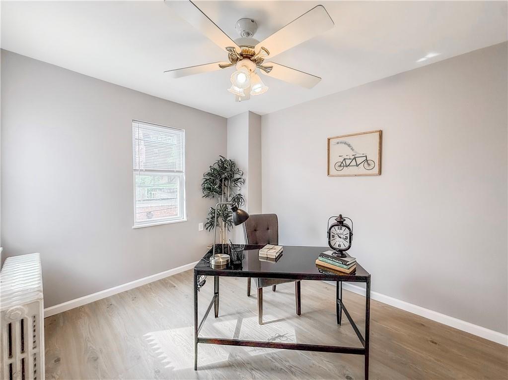 5642 Solway Street Pittsburgh, PA 15217 - Photo 23 of 28 a view of a workspace with furniture and wooden floor