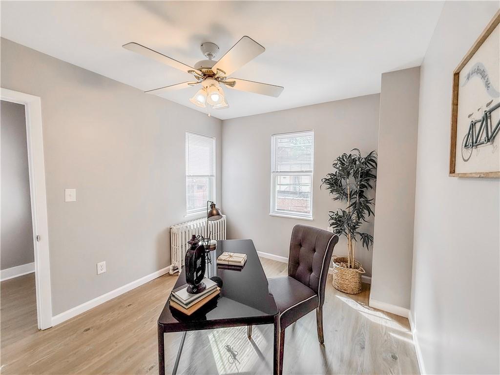 5642 Solway Street Pittsburgh, PA 15217 - Photo 24 of 28 a view of a dining room with furniture and chandelier