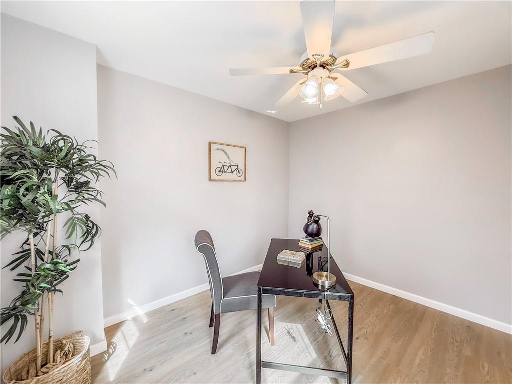 5642 Solway Street Pittsburgh, PA 15217 - Photo 25 of 28 a view of a workspace with furniture and a chandelier fan