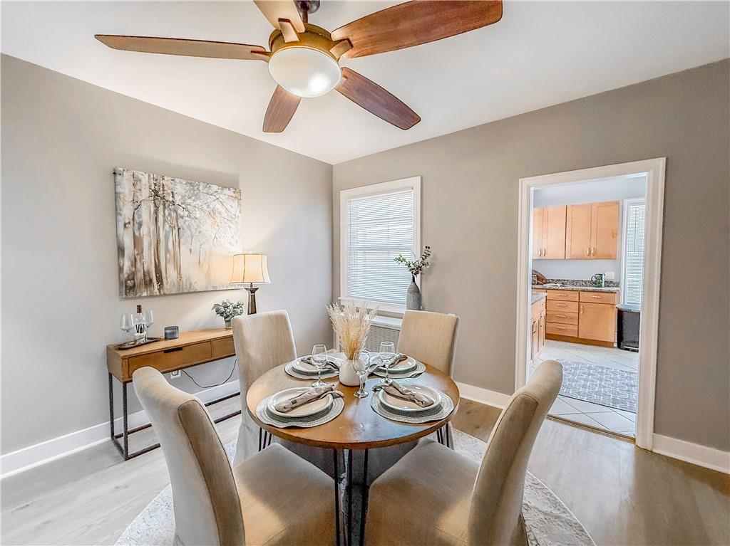 5642 Solway Street Pittsburgh, PA 15217 - Photo 7 of 28 a view of a dining room with furniture window and wooden floor
