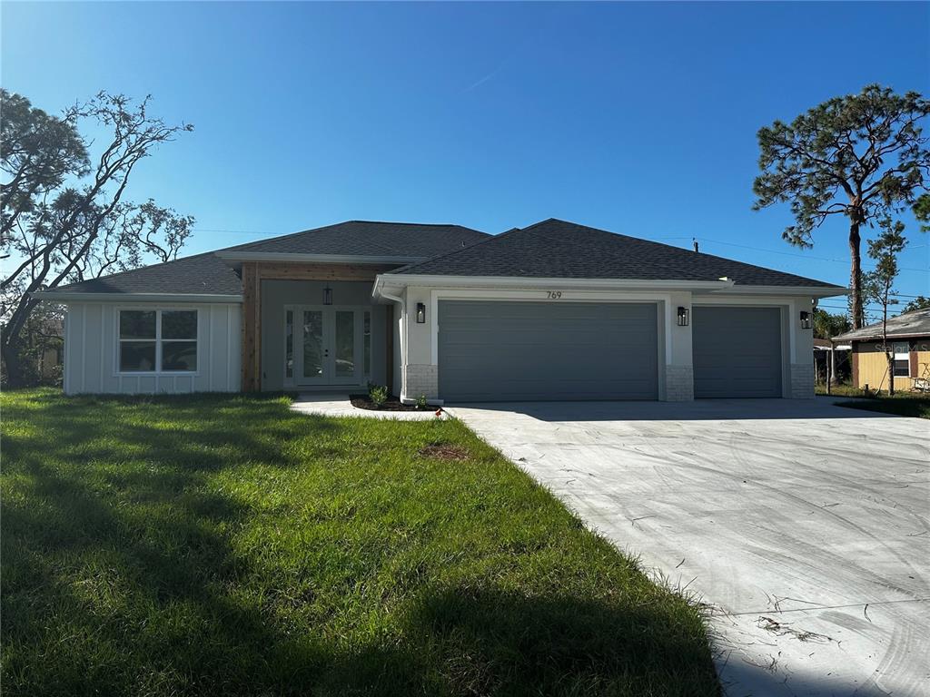 769 Missouri Road Venice, FL 34293 - Photo 1 of 1 a front view of a house with a garden