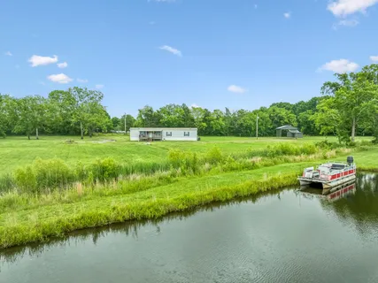 a view of a lake with houses in the background