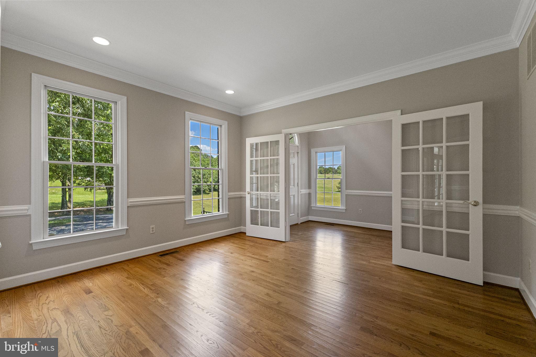 15906 Barnesville Road Boyds, MD 20841 - Photo 16 of 57 a view of empty room with wooden floor and fan