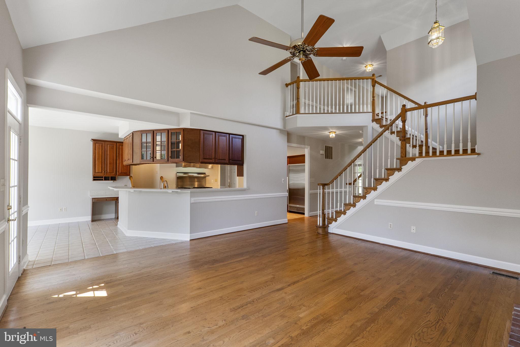 15906 Barnesville Road Boyds, MD 20841 - Photo 20 of 57 a view of a living room and kitchen with furniture wooden floor and a kitchen