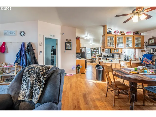 a living room with lots of furniture and a large window